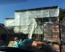 An Image of a house that is being renovated using scaffolding